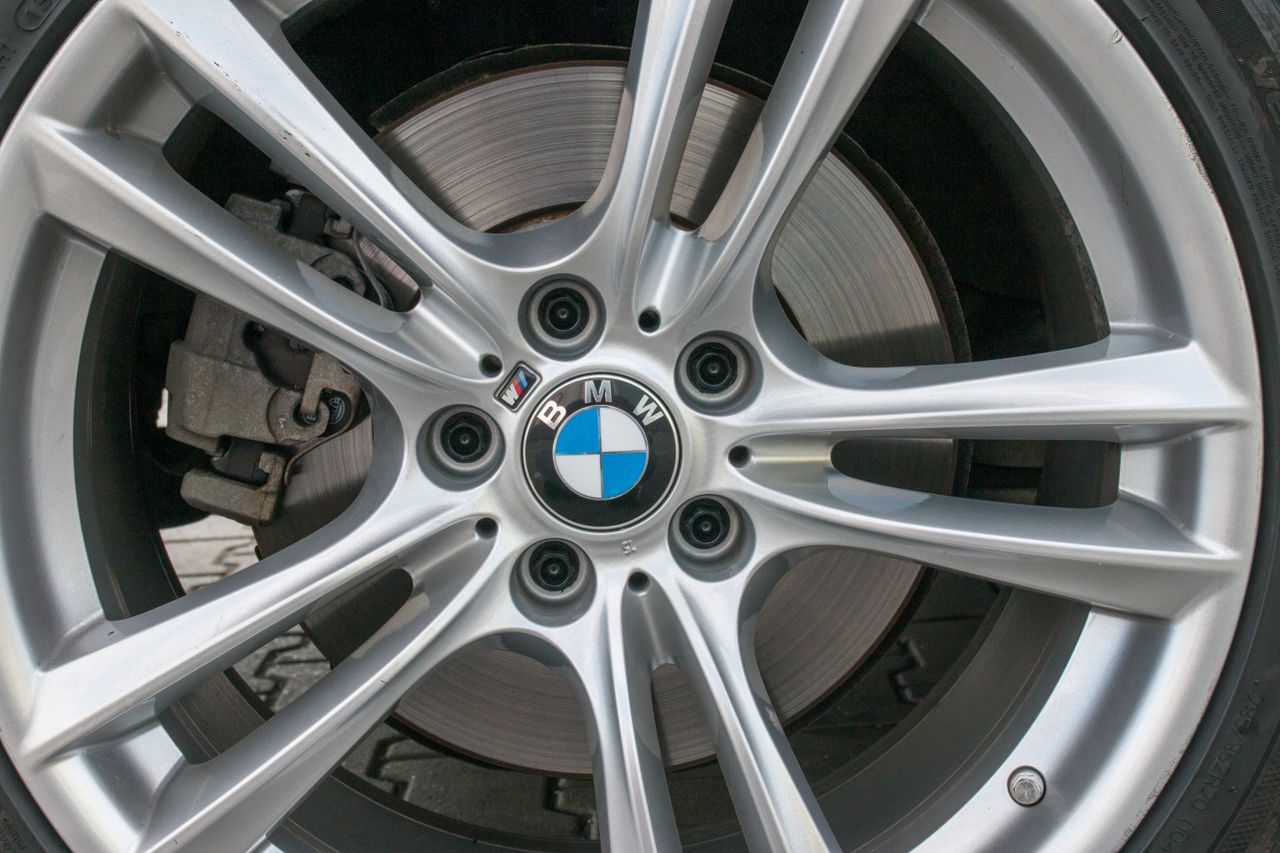 Detailed image of a BMW car wheel rim showcasing intricate design and luxury.